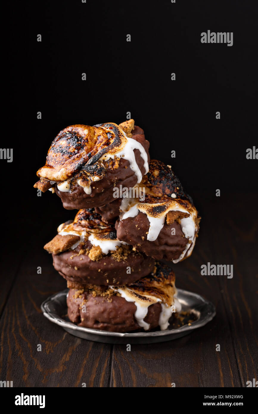 Smores old fashioned fried donuts stack on dark background Stock Photo