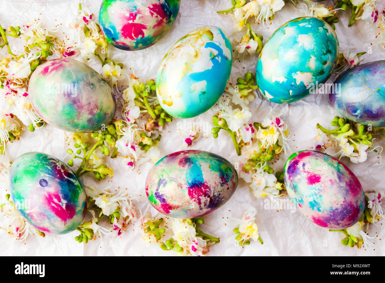 Easter eggs and spring flowers background flat lay Stock Photo - Alamy