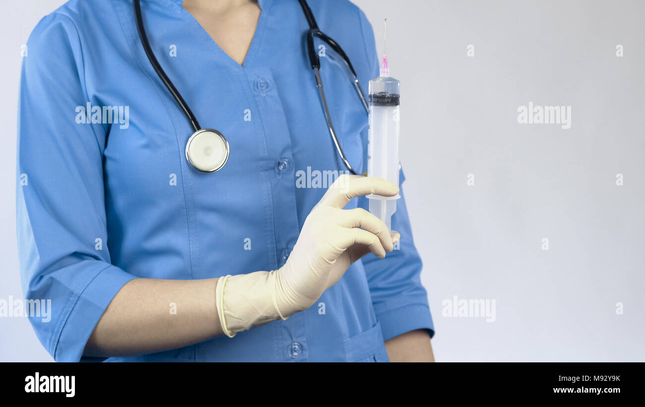 Veterinarian with syringe in hand, euthanasia of animals, vaccination, antivirus Stock Photo