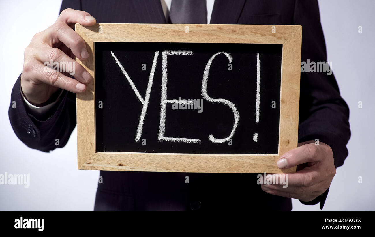 Yes with exclamation mark written on blackboard, readiness for business concept Stock Photo