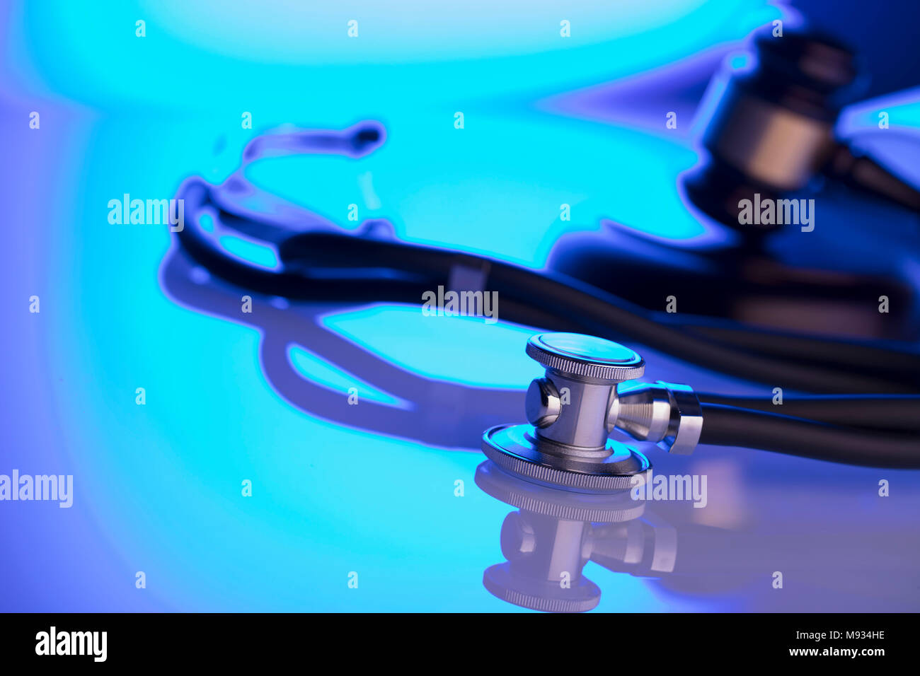 Medical law concept. Gavel and stethoscope, blue light. Place fort text. Stock Photo