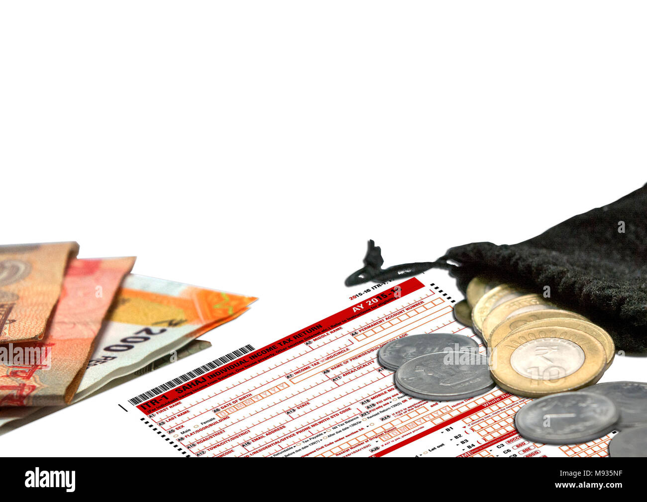 Tax Form ITR-1 with Indian Currency o 10 Rupee Coins in Bang Stock Photo