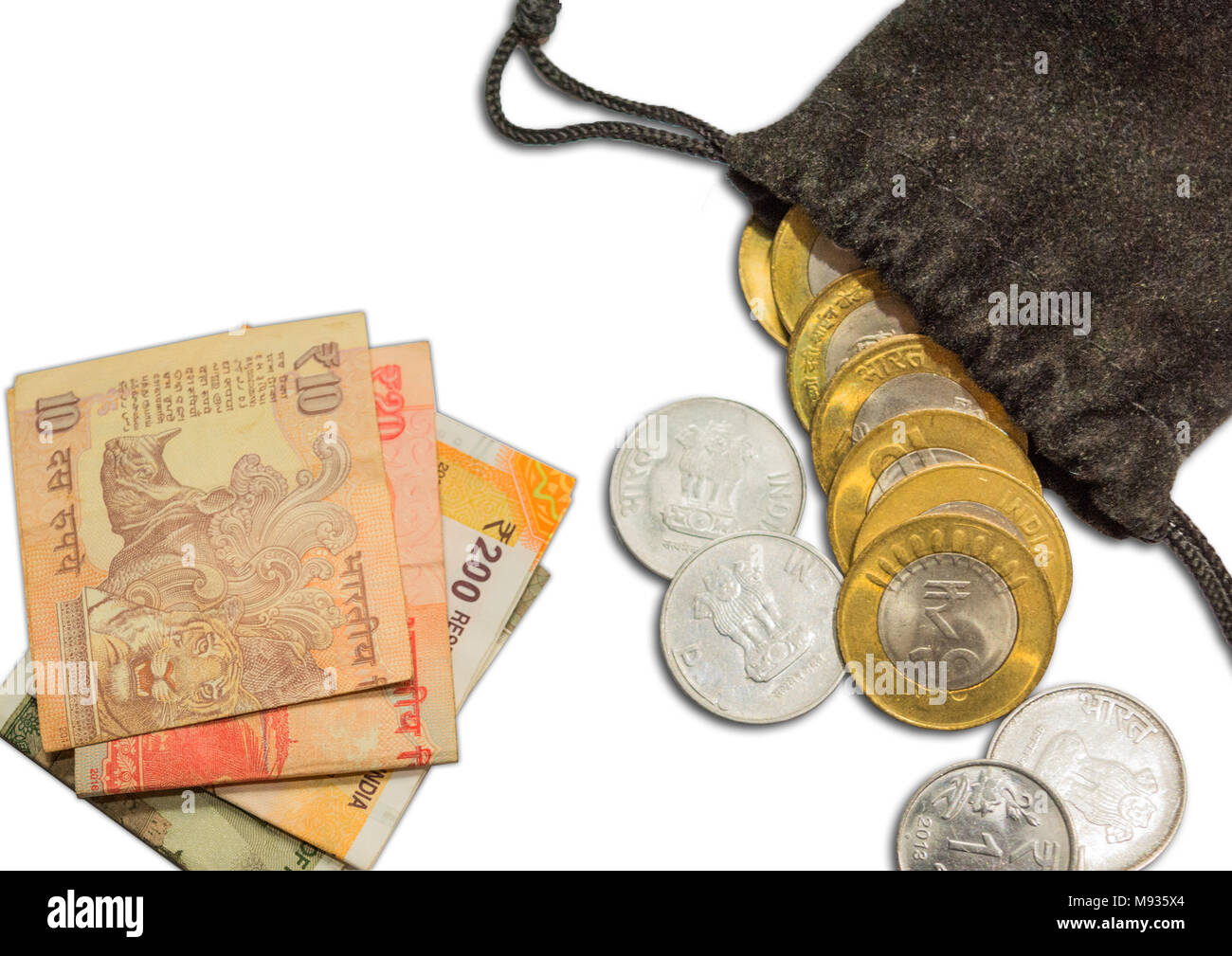 Indian Currency 10 rupee Coins in Bag with New 200.500 and 20,10 Currencies Stock Photo