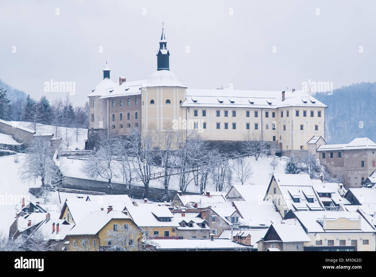 Skofja Loka castle and old town covered in fresh snow. Stock Photo