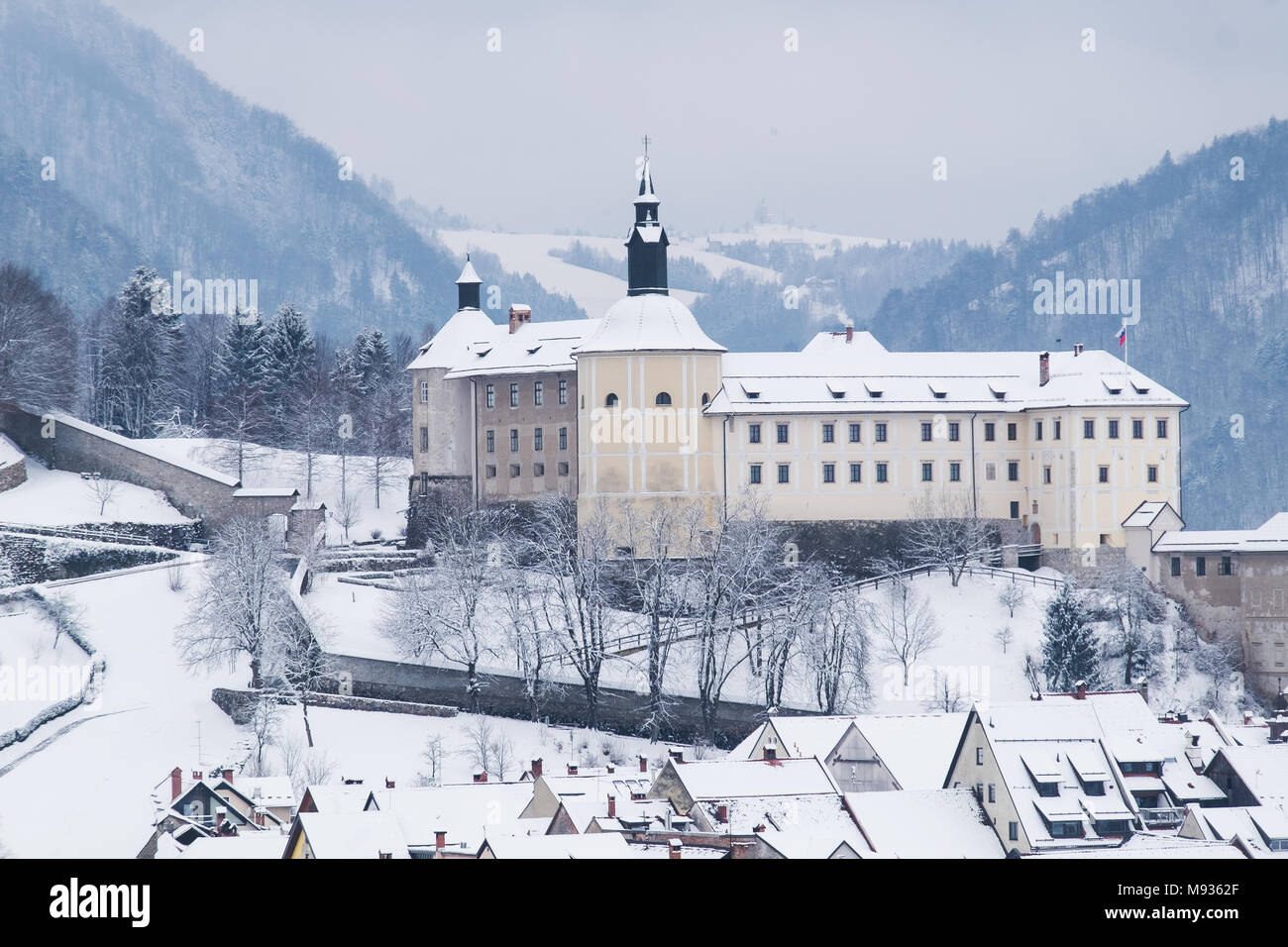 Skofja Loka castle and old town covered in fresh snow. Stock Photo