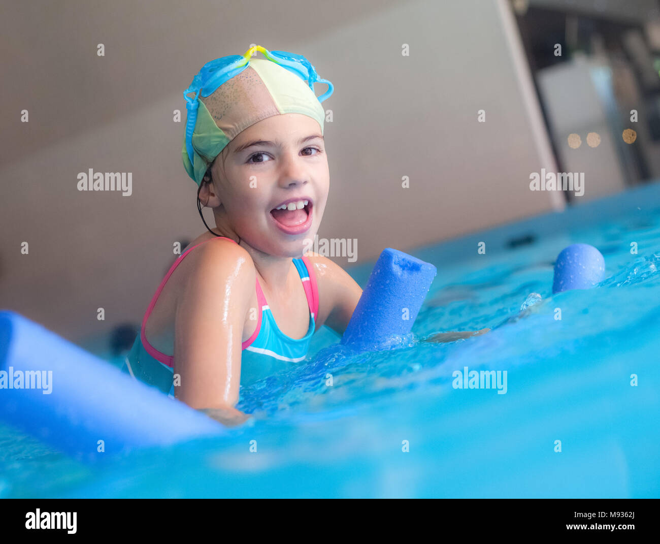 Swimming Pool Girl Noodle Foam Stock Photo