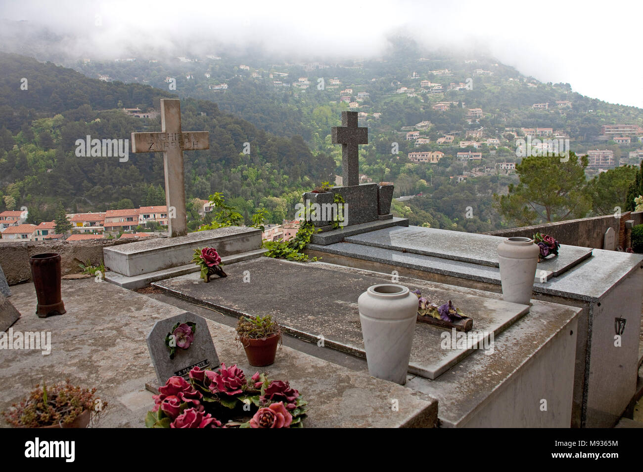 Fog over tombs at cementary of medieval Èze Village, Provence, Var, Cote Azur, South France, France, Europe Stock Photo