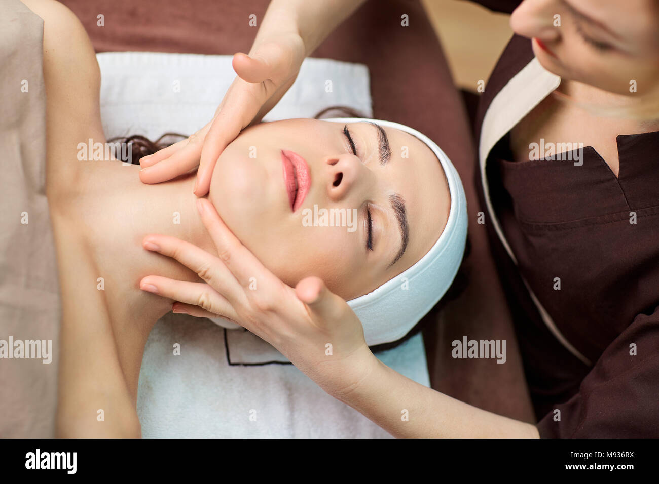 Beautiful woman at a facial massage at a spa salon Stock Photo