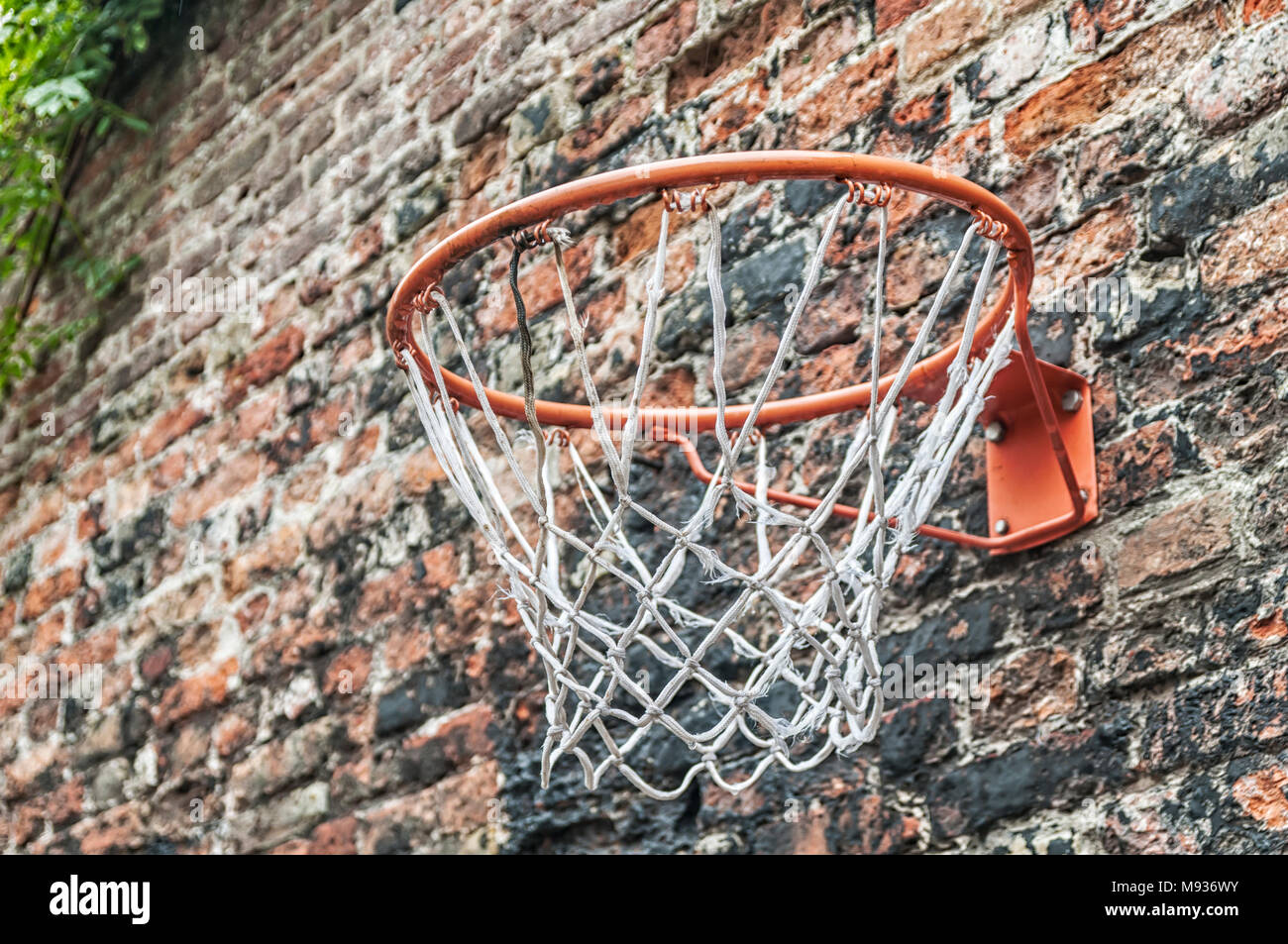 Basketball Hoop Attached To A Stone Wall Stock Photo Alamy