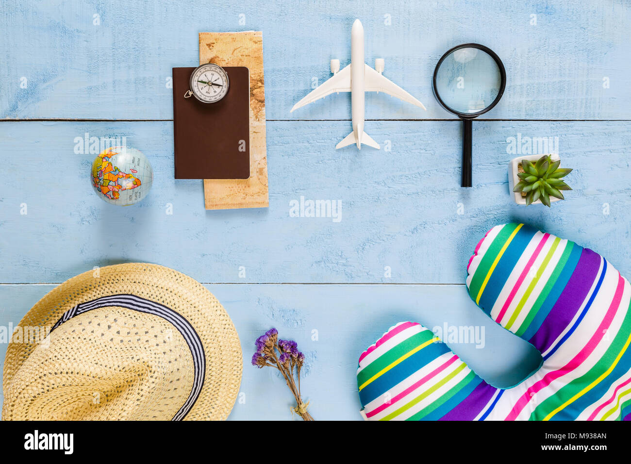 Top view essential travel items. map, passport, airplane, blue wooden   space for creative design text and  lay different  objec Stock Photo - Alamy
