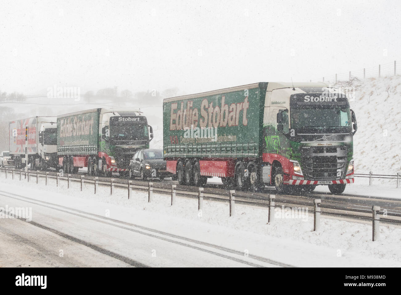 Eddie Stobart lorries stationary in snow on the A66, England, UK Stock Photo