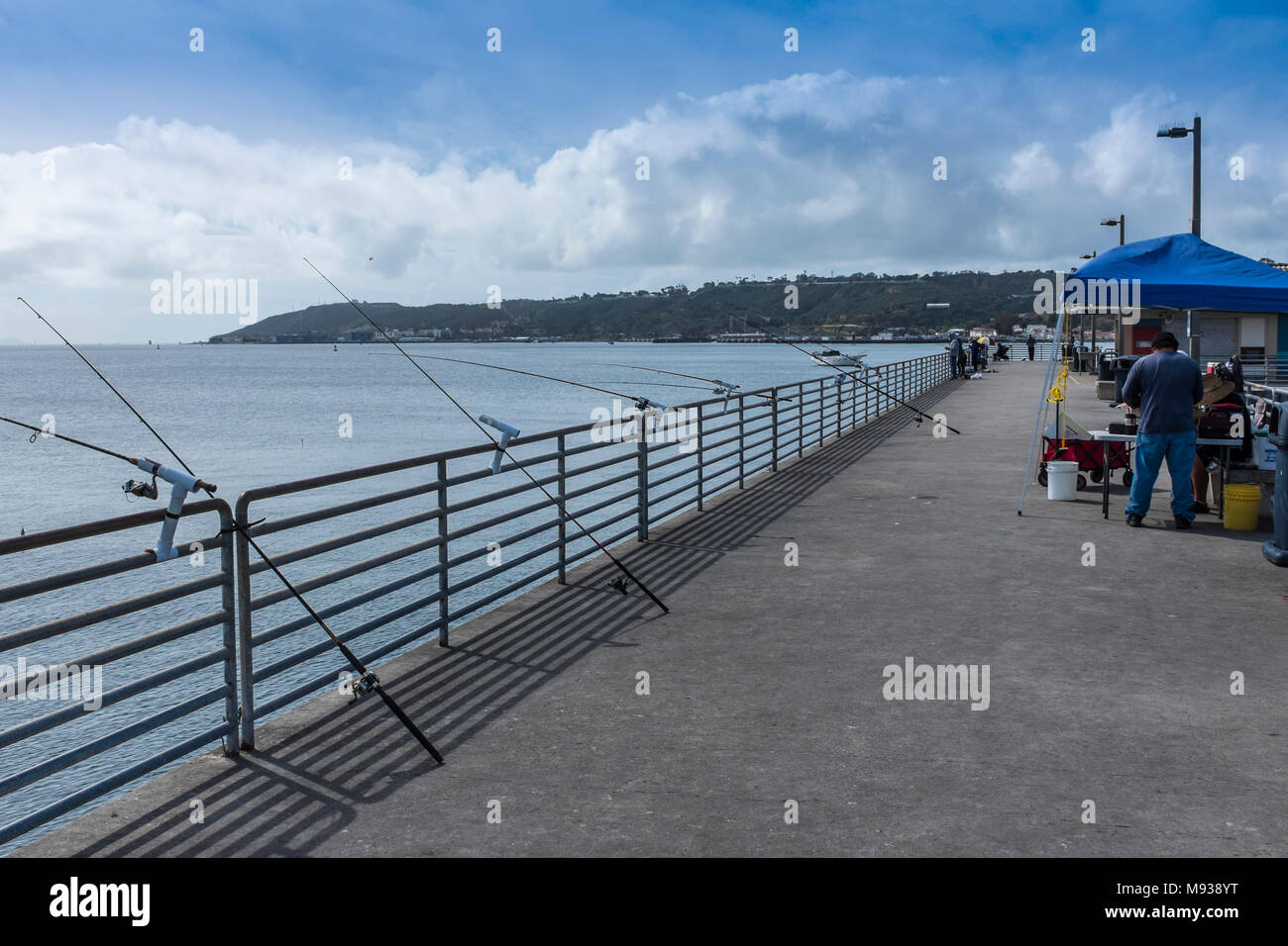 SAN DIEGO, CALIFORNIA, USA - Fishing rods on the pier at Shelter Island in San Diego. Stock Photo