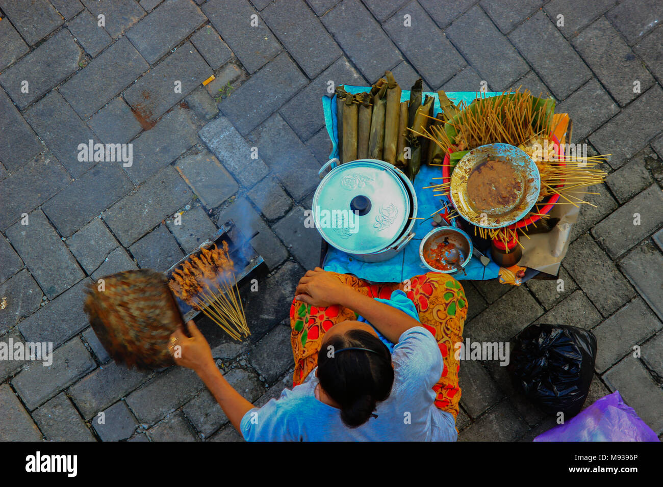 Satay madura (indonesian: sate) originated on the Indonesian island of Java. It is available almost anywhere in Indonesia. Stock Photo