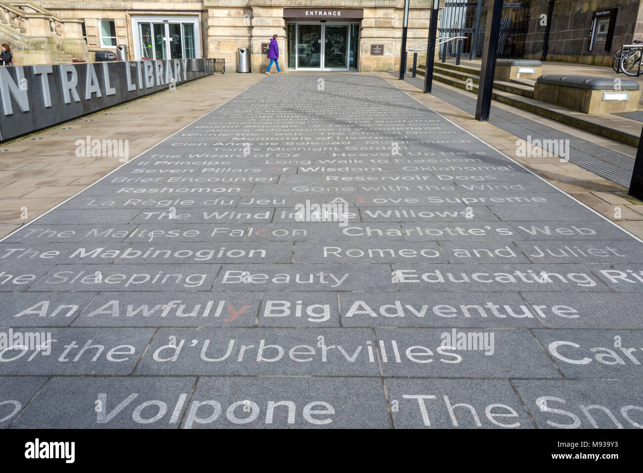 Book titles set into paving stones at the entrance of the Central Library.  St. George's Quarter, Liverpool, England, UK Stock Photo