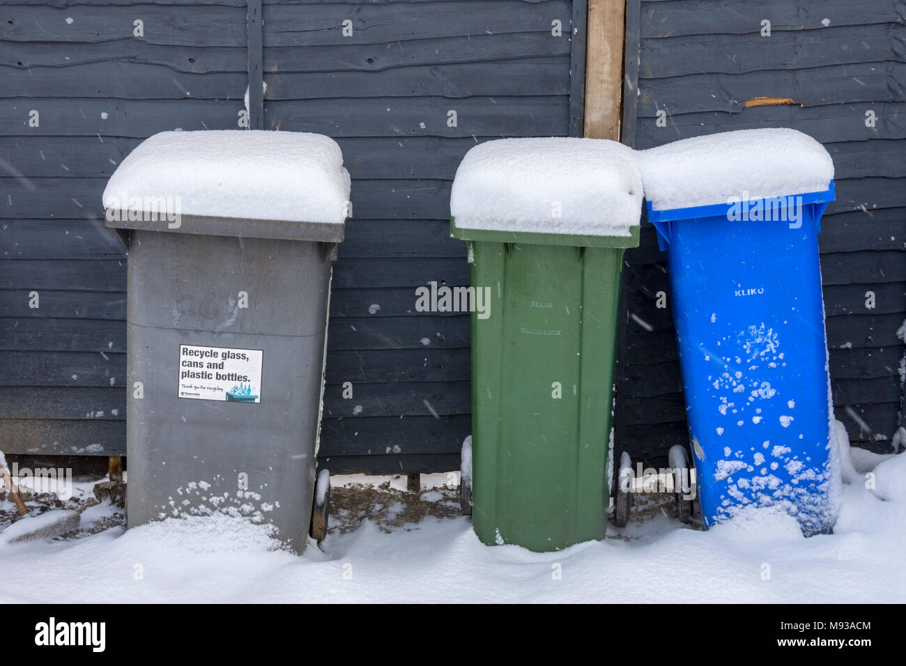 Snow covered wheelie bins in a suburban street, Tameside, Manchester