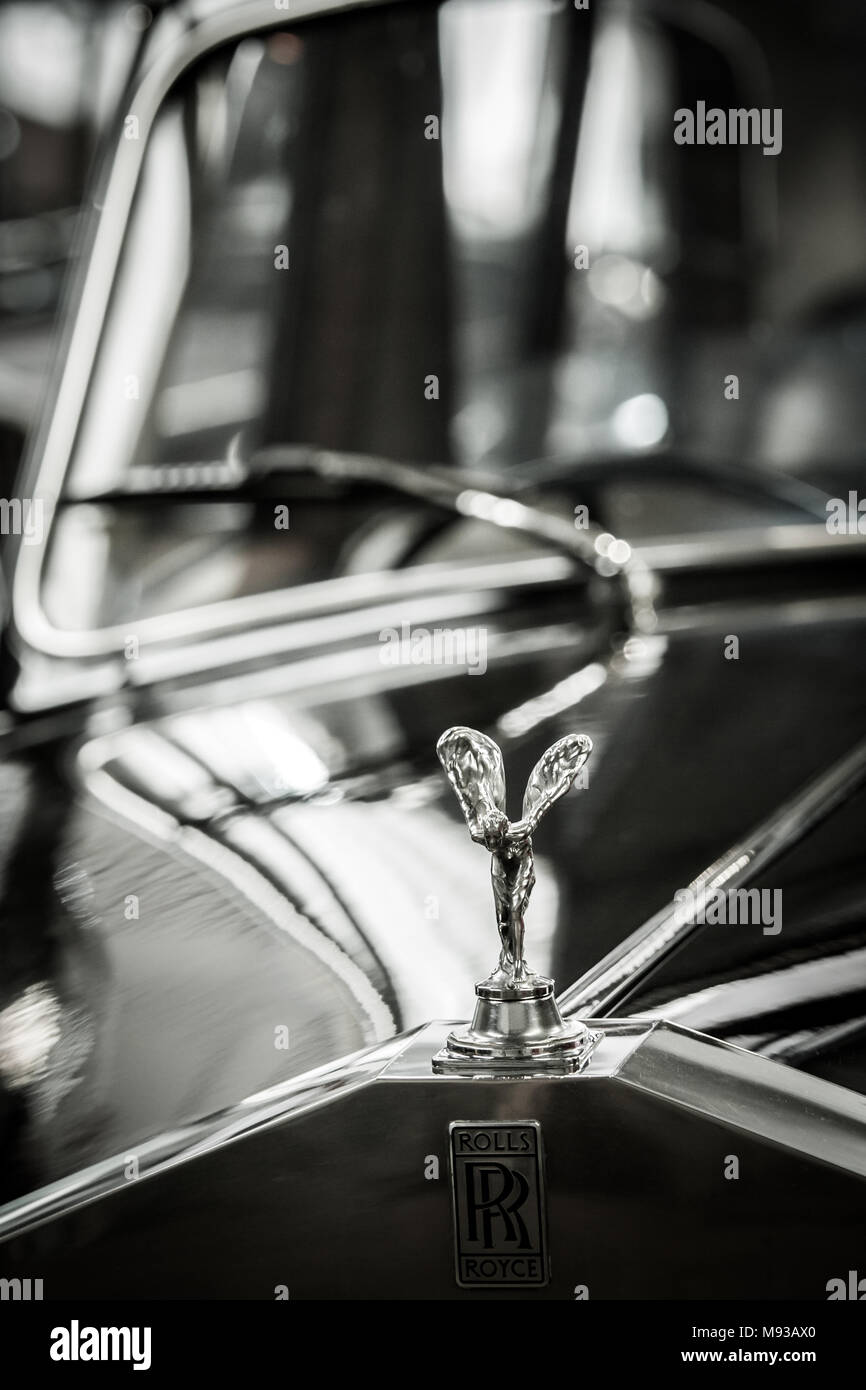 Black and white image of the famous Flying Lady iconic symbol on Classic Car Rolls Royce the car manufacturer world renown for prestigious luxury cars Stock Photo