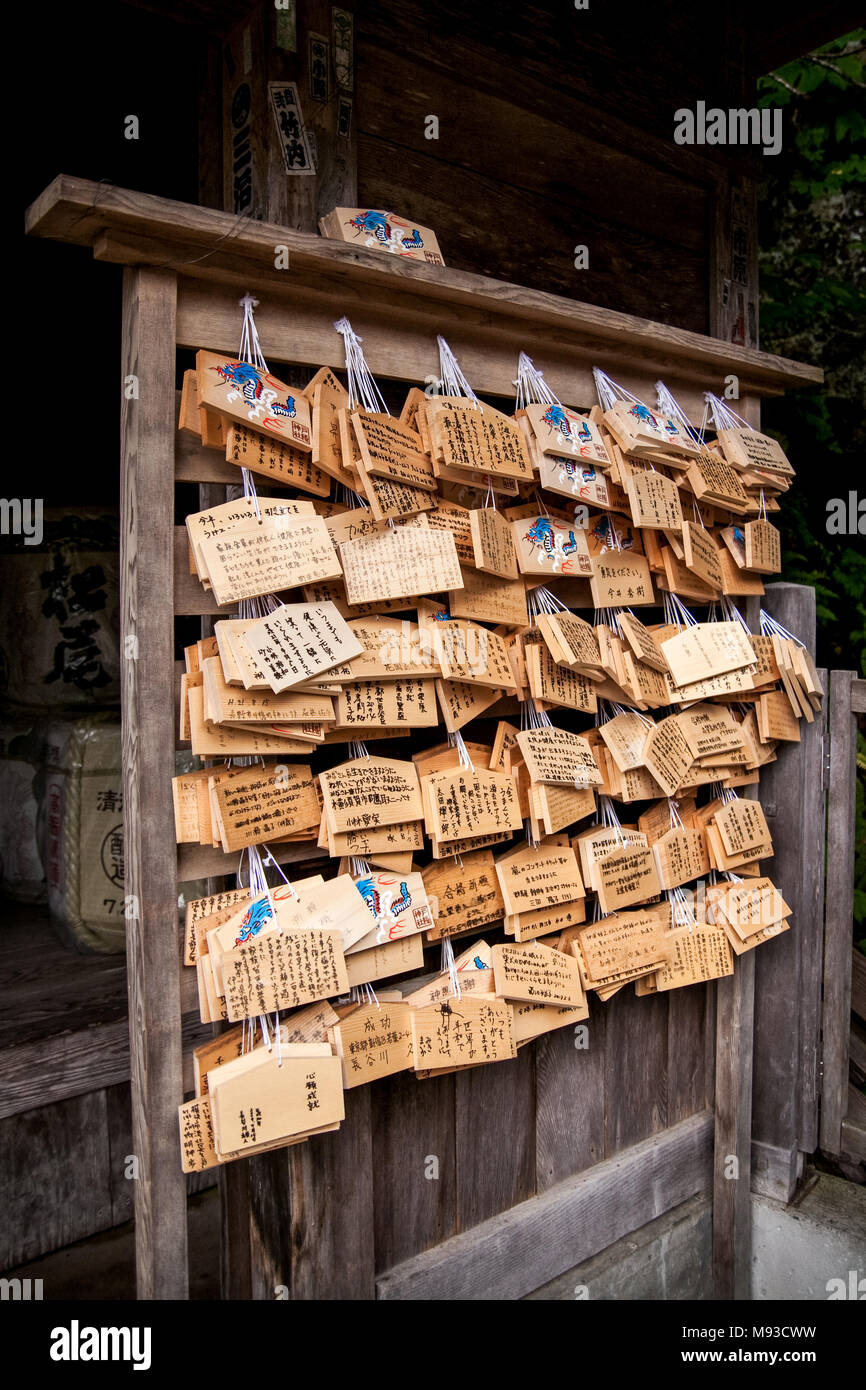 Wooden plaques known as Ema in Japanese which has a literal meaning of Picture Horse are wooden wishing plaques, part of the Japanese Shinto religion Stock Photo