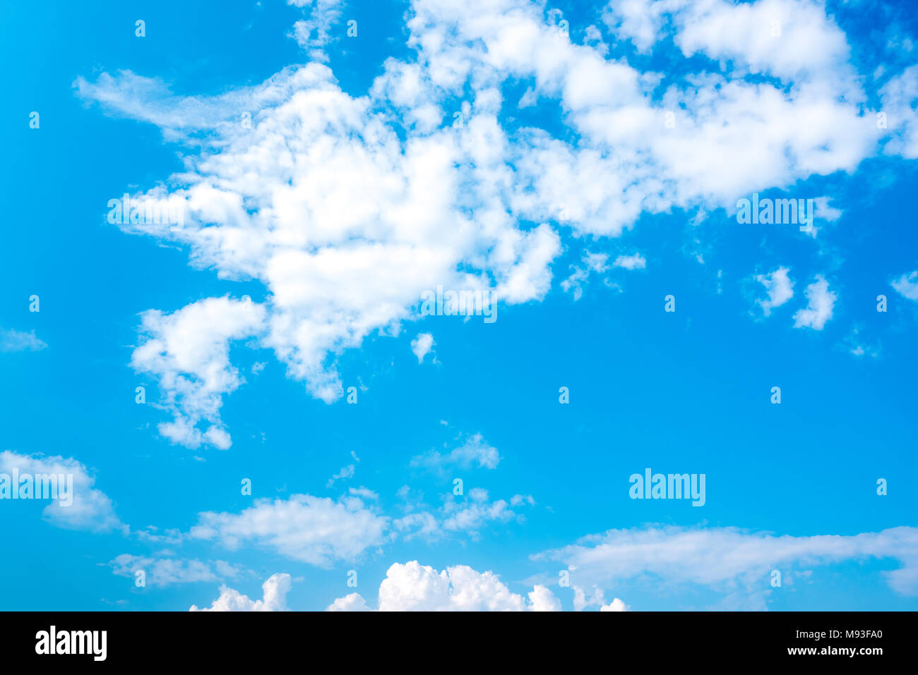 Blue sky and white cumulus clouds background Stock Photo - Alamy