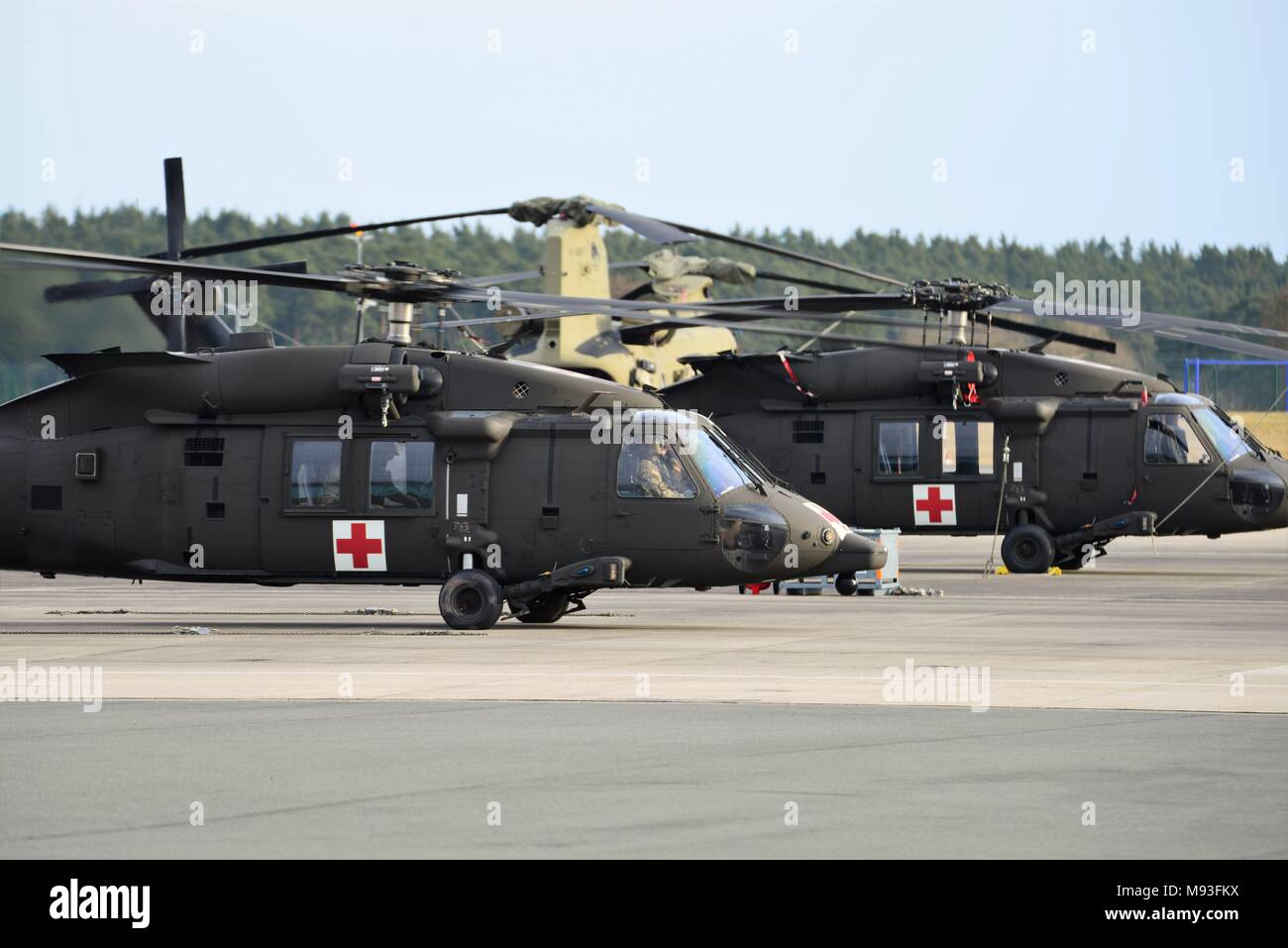 U.S. Soldiers with the 1st Air Cavalry Brigade out of Fort Hood Texas conduct routine home station training for the aircraft and ground crews with the HH-60 MEDEVAC helicopters at Katterbach Army Airfield in Ansbach, Bavaria, Germany March 15, 2018. The 1st Air Cavalry Brigade is on a nine-month rotation in support of Atlantic Resolve. Atlantic Resolve is a demonstration of continued U.S. commitment to collective security through a series of actions designed to reassure NATO allies and partners of America's dedication to enduring peace and stability in the region. (U.S. Army photo by Charles R Stock Photo