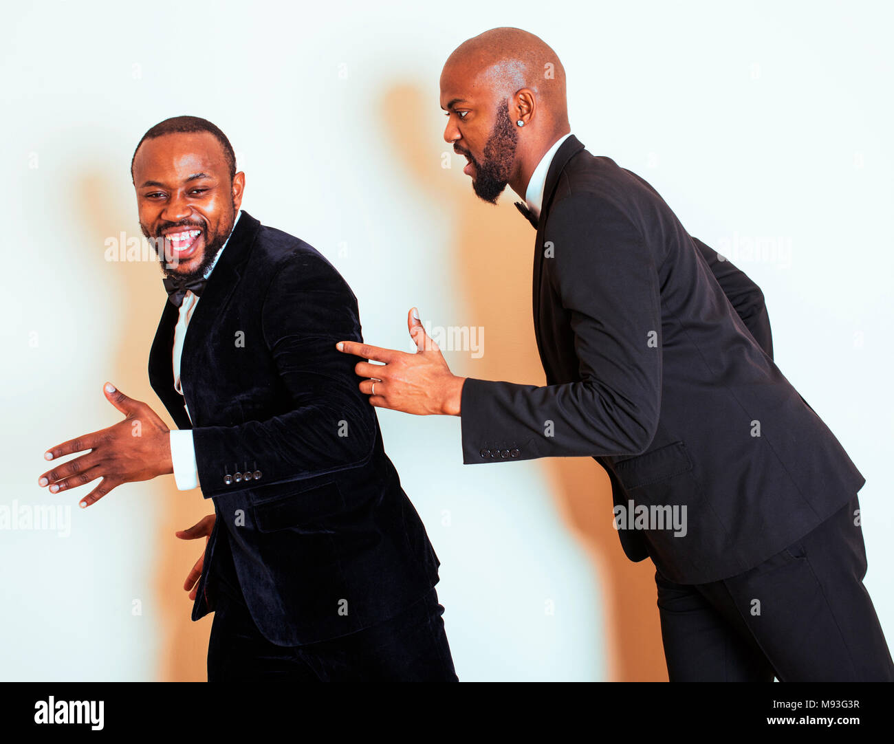 two afro-american businessmen in black suits emotional posing, g Stock ...