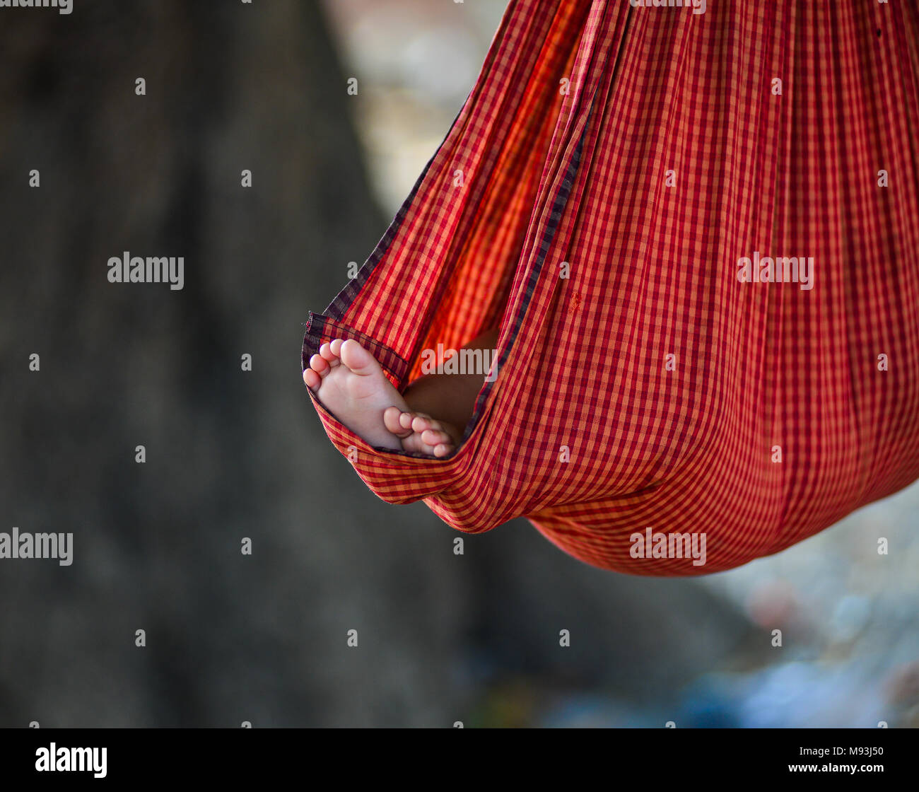 A child sleeping on cot at the village in Mandalay, Myanmar Stock Photo