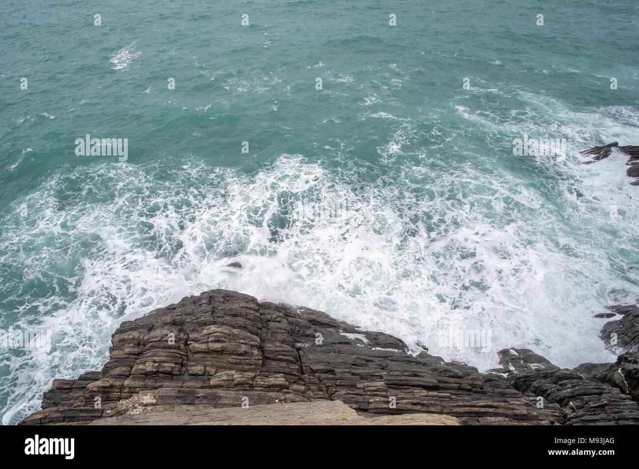 Sea waves crashing on the rock Stock Photo - Alamy