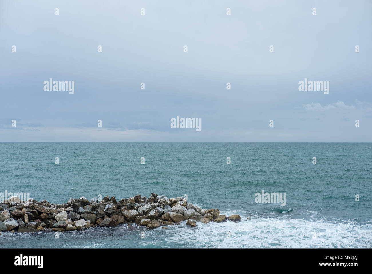 Sea waves crashing on the rock Stock Photo - Alamy