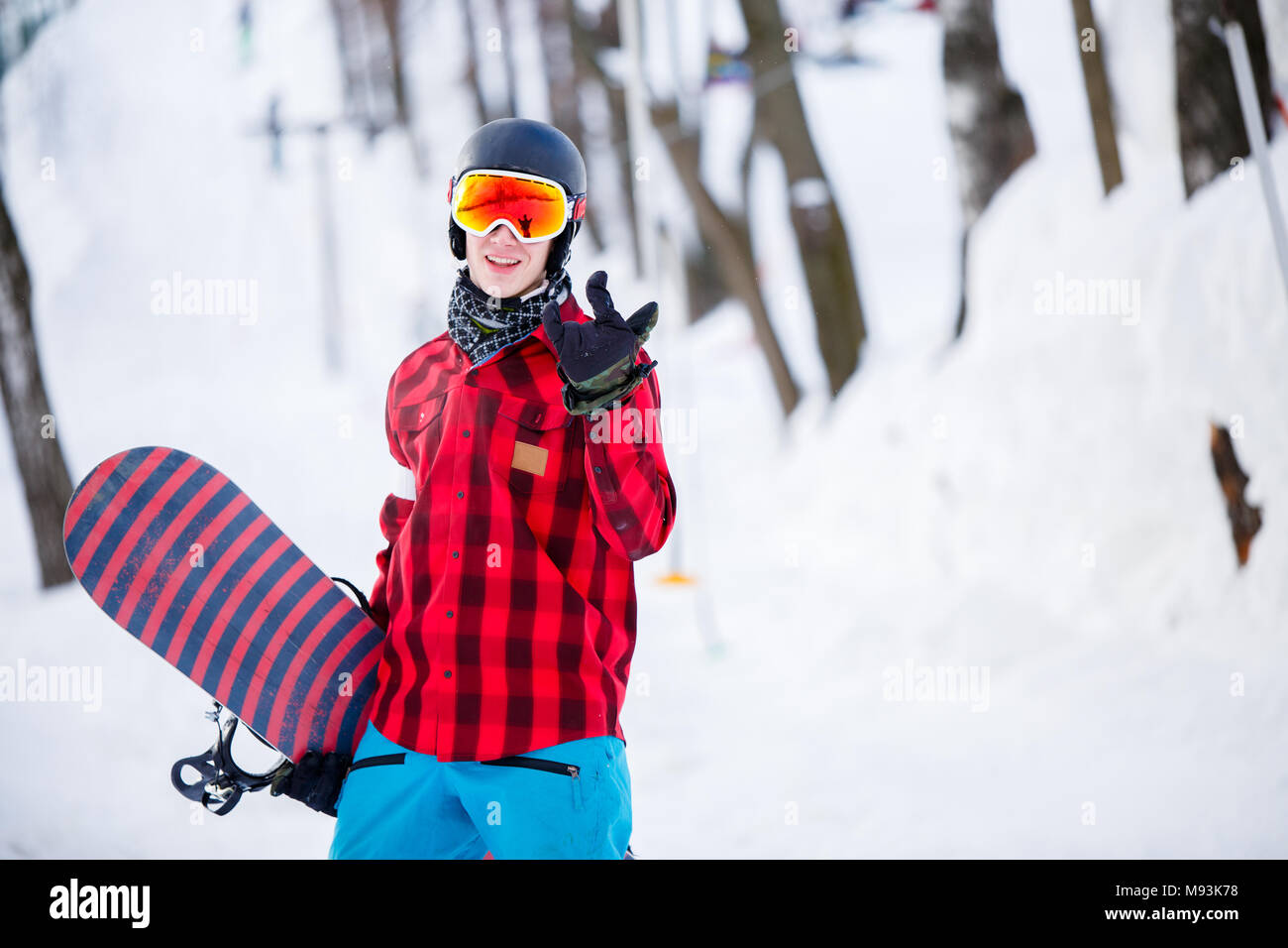 Photo of sporty man wearing helmet with snowboard Stock Photo
