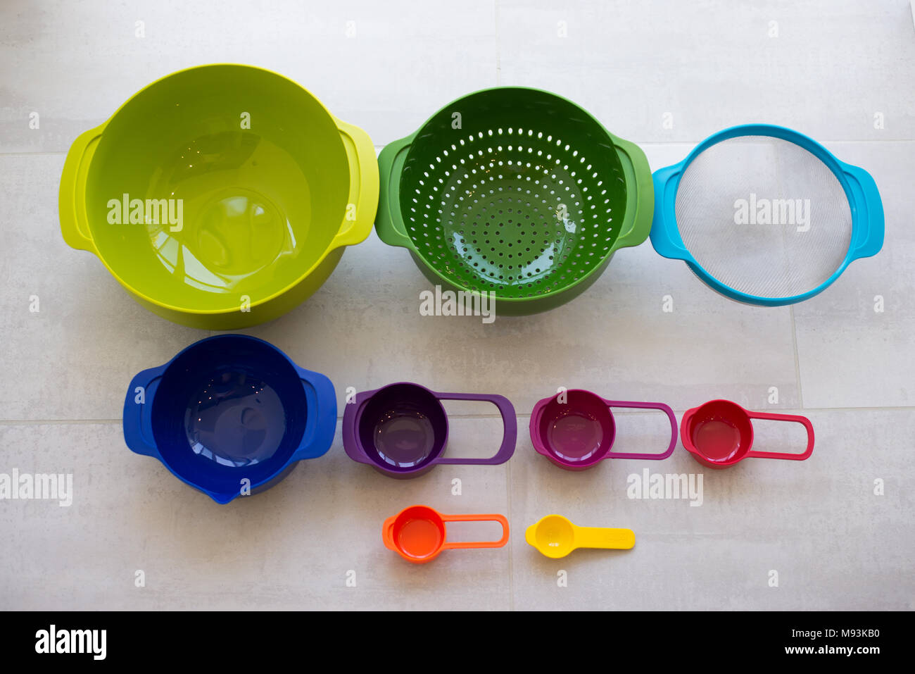 Plastic cups of a multicolored dish in the kitchen Stock Photo Alamy