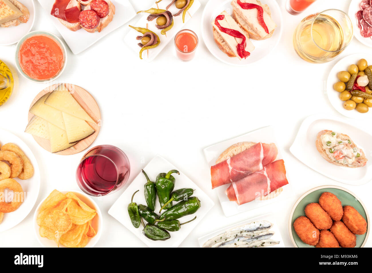 An overhead photo of a collection of Spanish tapas food, shot from