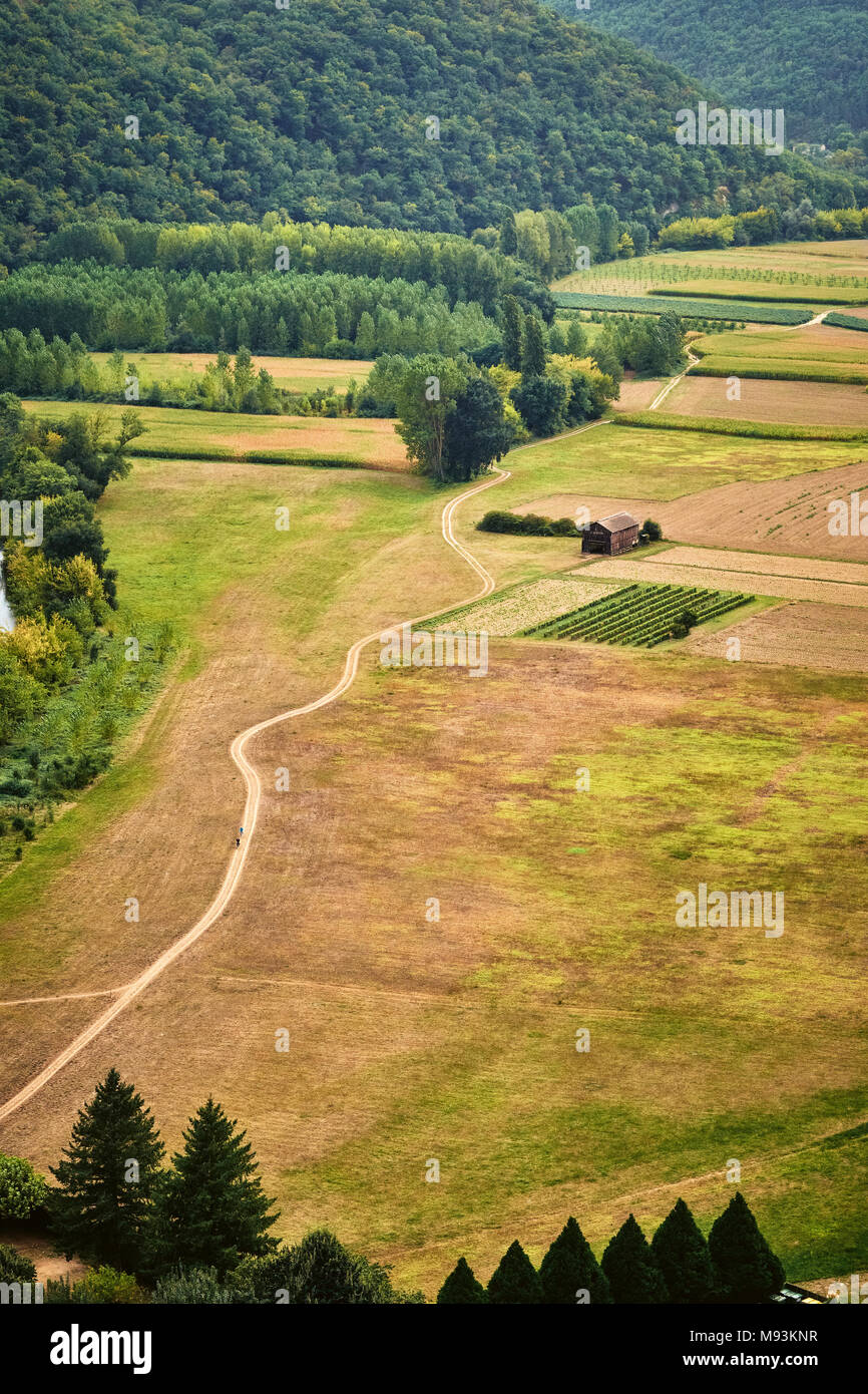 A meandering country track in the Dordogne valley in France. Stock Photo