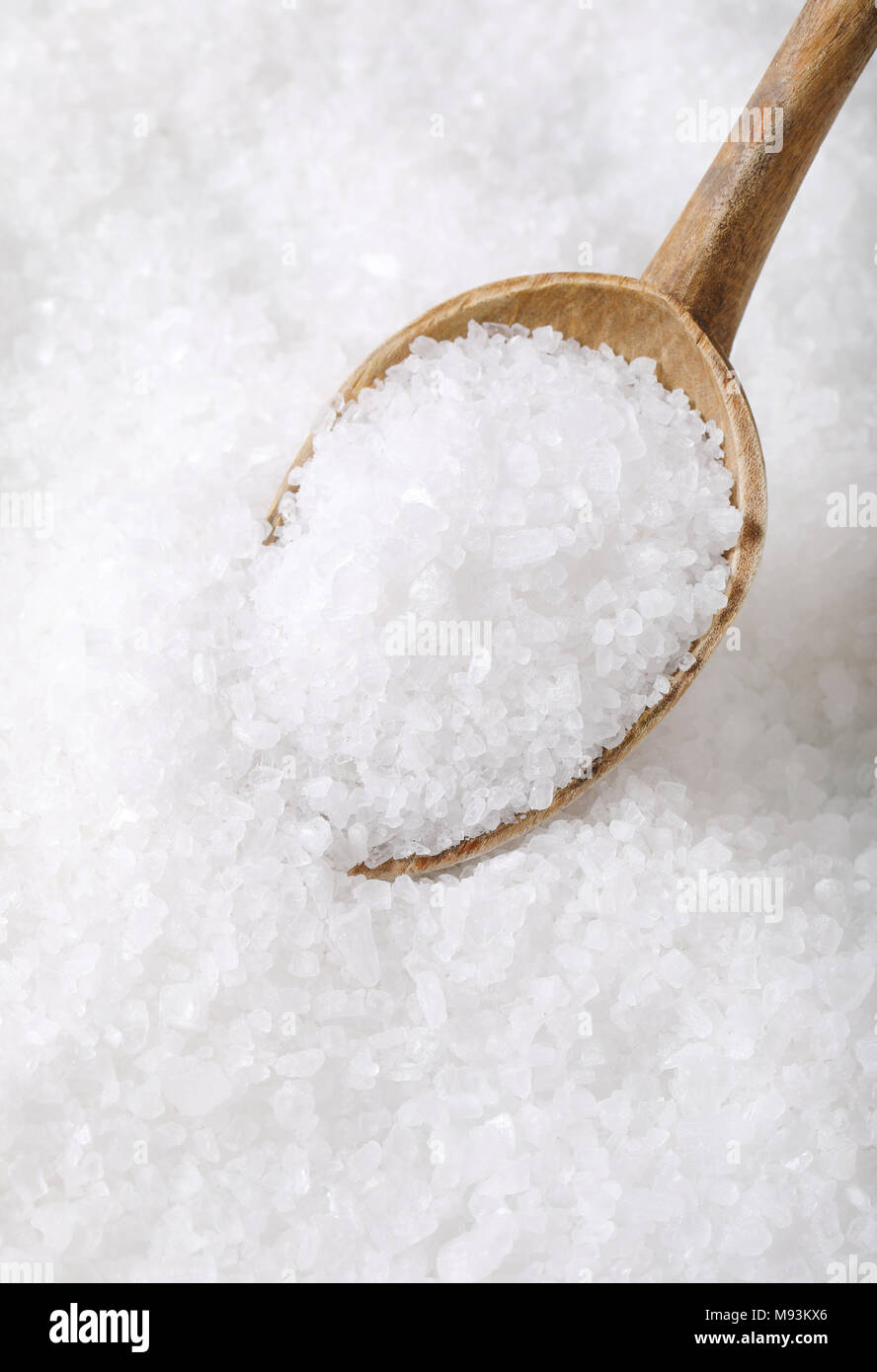 coarse grained sea salt on a wooden spoon Stock Photo - Alamy