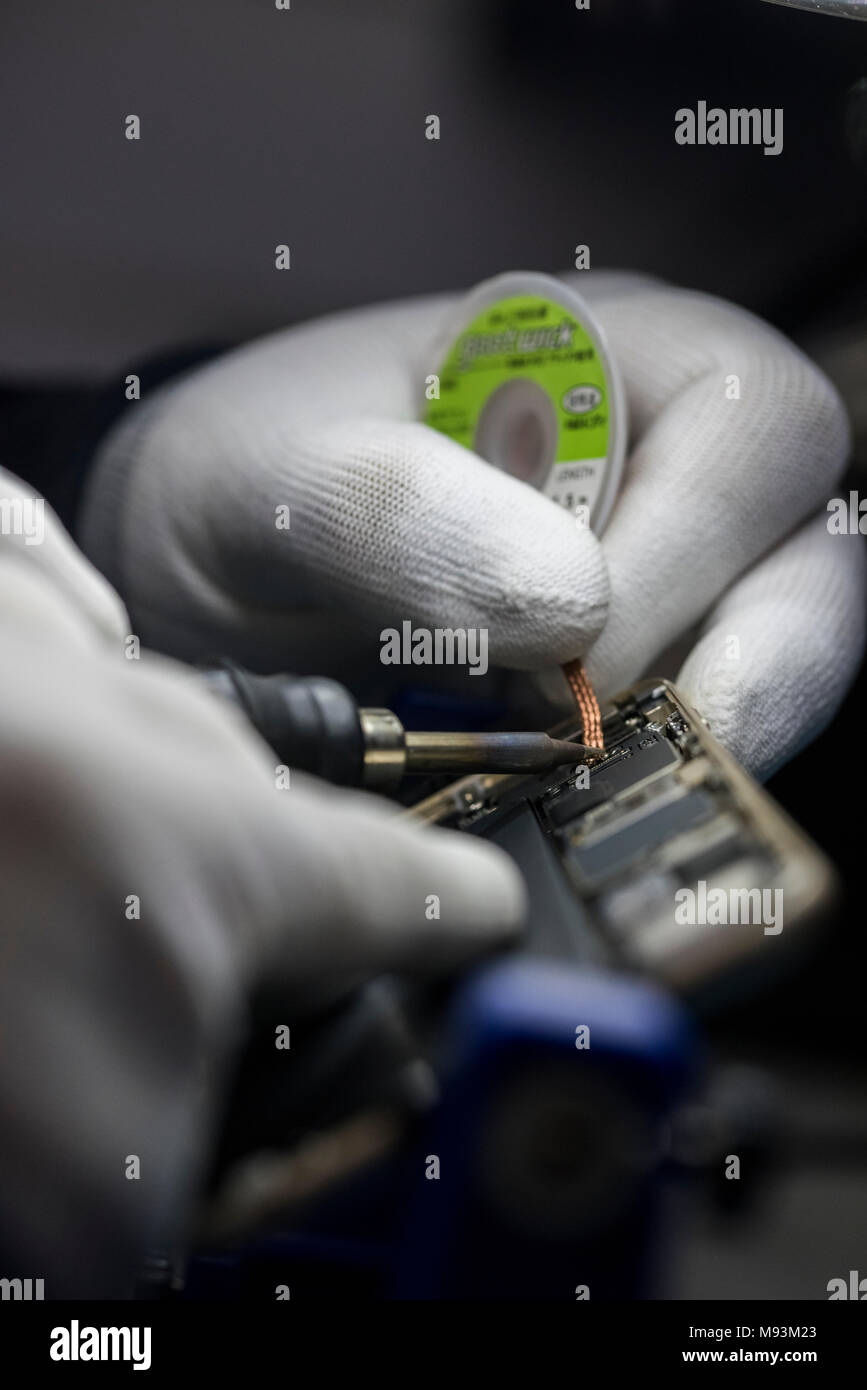 Reparing electronics devices, chips, motherboards, welding Stock Photo