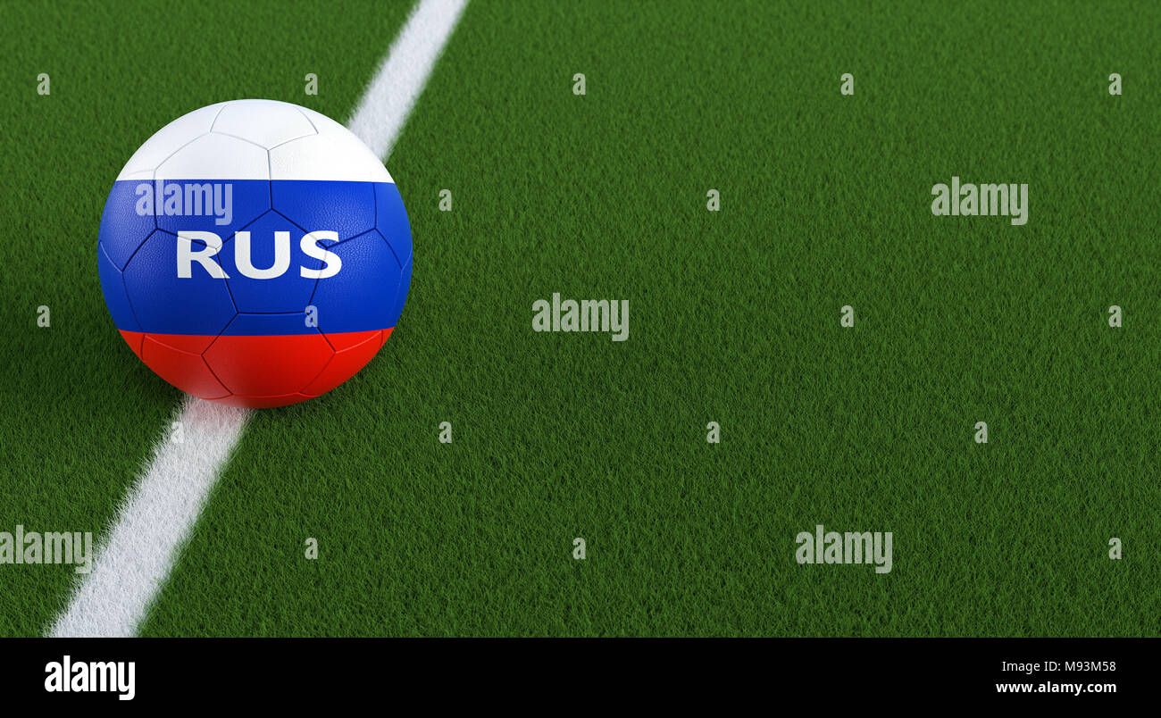 Soccer ball in russian national colors on a soccer field. Copy space on