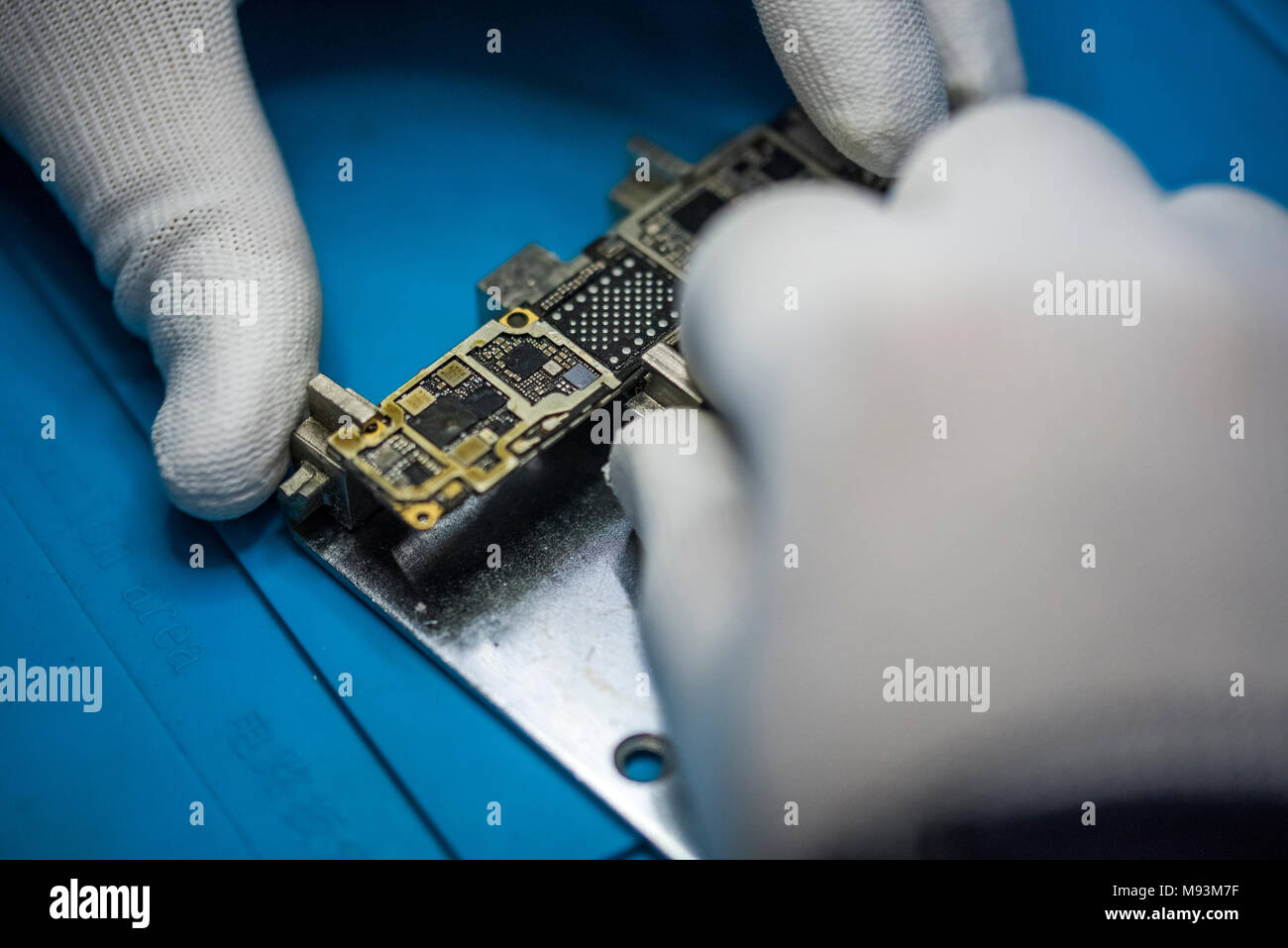 Reparing electronics devices, chips, motherboards, welding. Circuit. Stock Photo