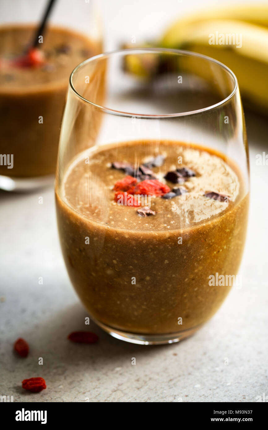 Banana Flax Meal Goji And Coconut Coffee Smoothie With Cocoa Nibs And Goji Topping Stock Photo Alamy