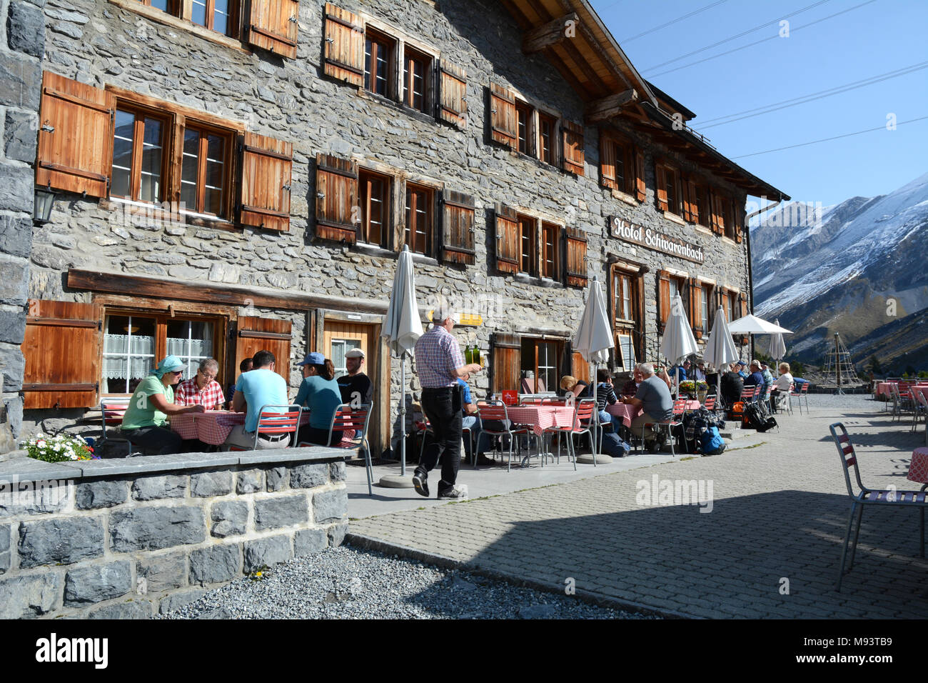 A cafe along the Bernese-Oberland hiking route through the Gemmi Pass in the Bernese Alps near the Swiss town of Leukerbad, Valais, Switzerland. Stock Photo