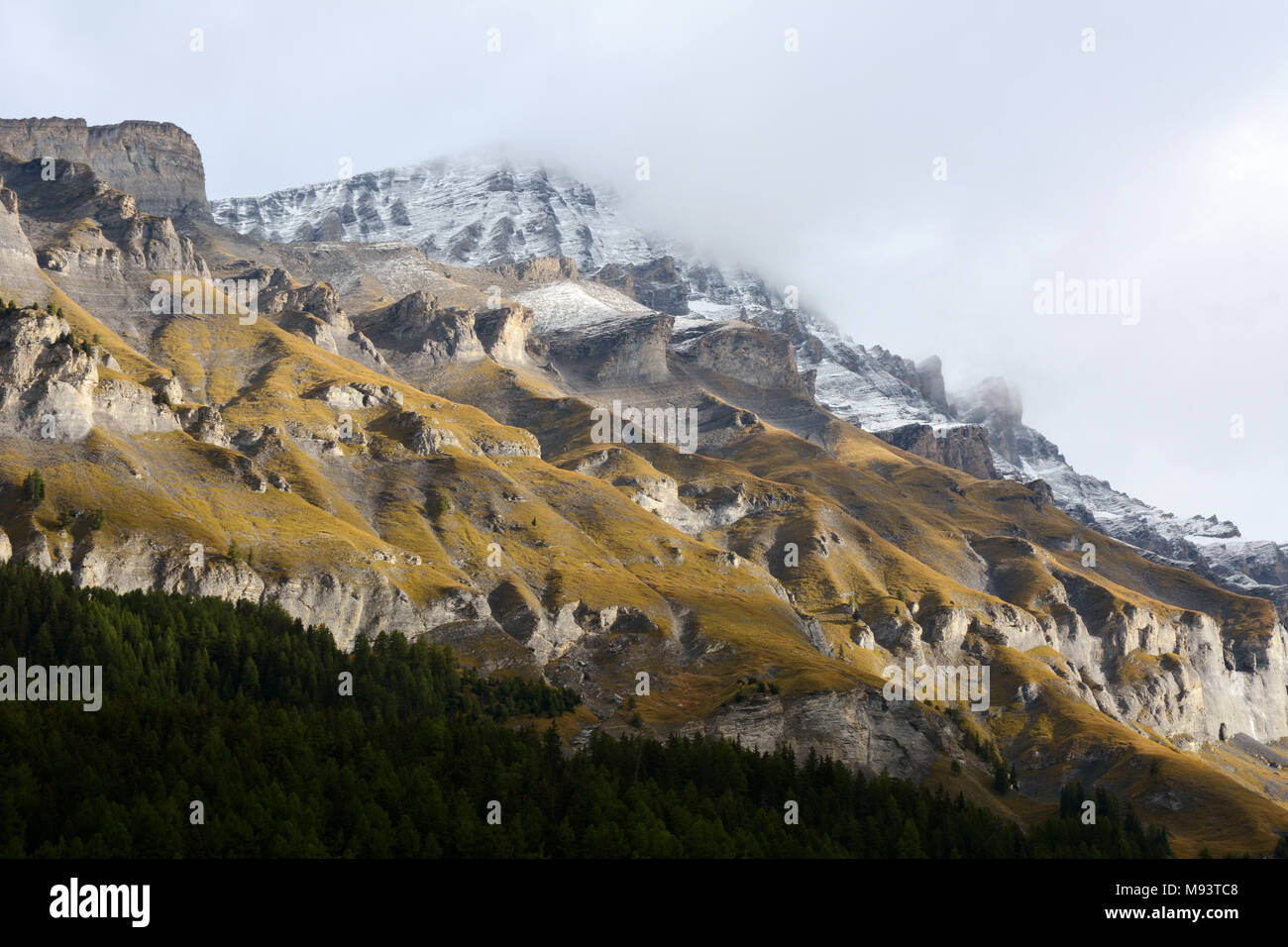 Rinderhorn and the mountains of the Gemmi Pass in the Bernese Alps overlooking the Swiss alpine resort town of Leukerbad, Valais canton, Switzerland. Stock Photo