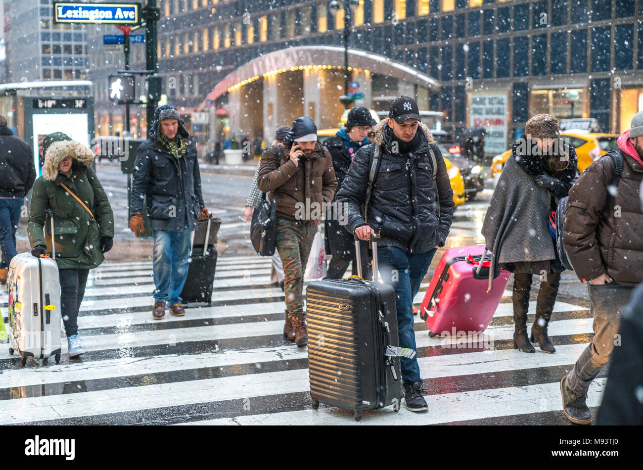 New York, USA. 21 March 2018.  People just continue their normal life under a snowstorm in New York city.  Photo by Enrique Shore/Alamy Stock Photo Stock Photo