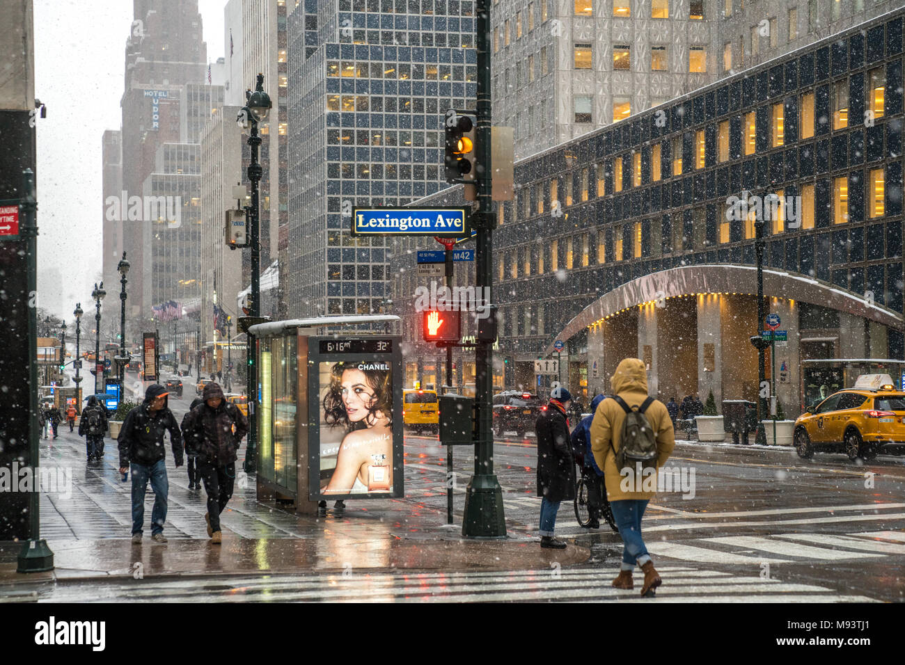 New York, USA. 21 March 2018.  People just continue their normal life under a snowstorm in New York city.  Photo by Enrique Shore/Alamy Stock Photo Stock Photo