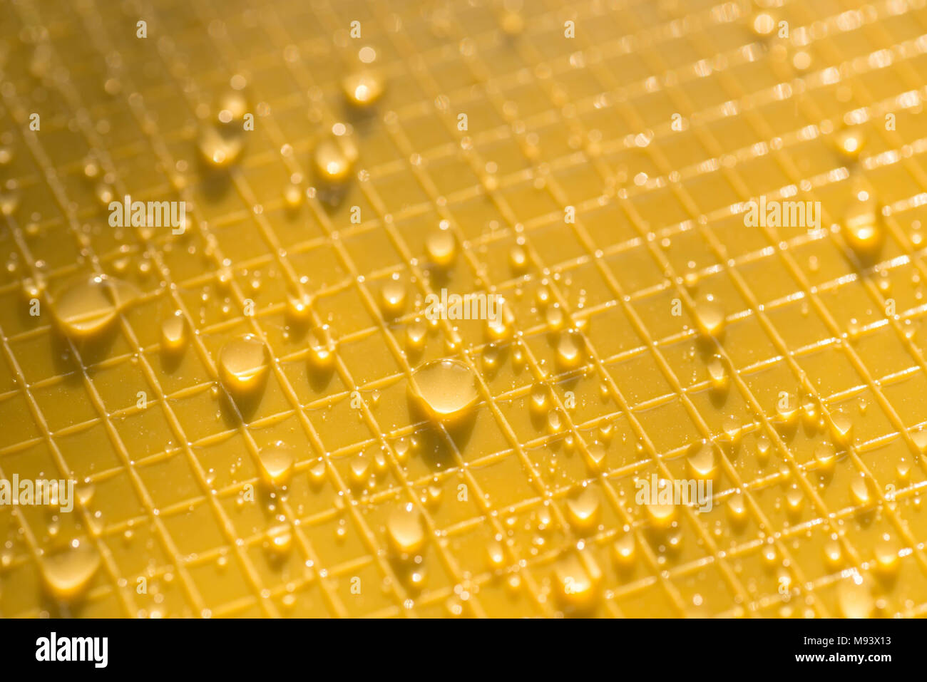 water drops on yellow color plastic background texture Stock Photo