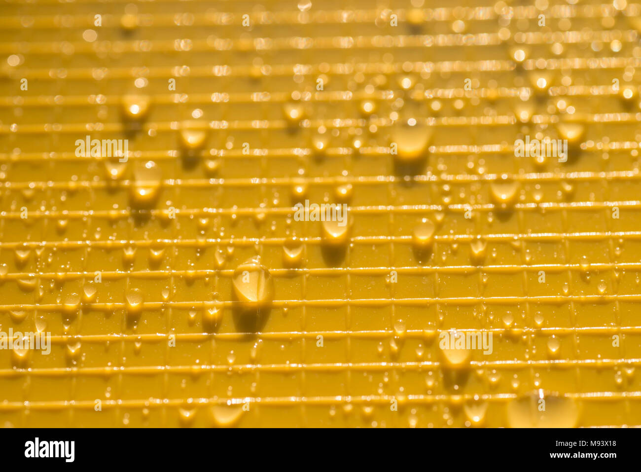 water drops on yellow color plastic background texture Stock Photo