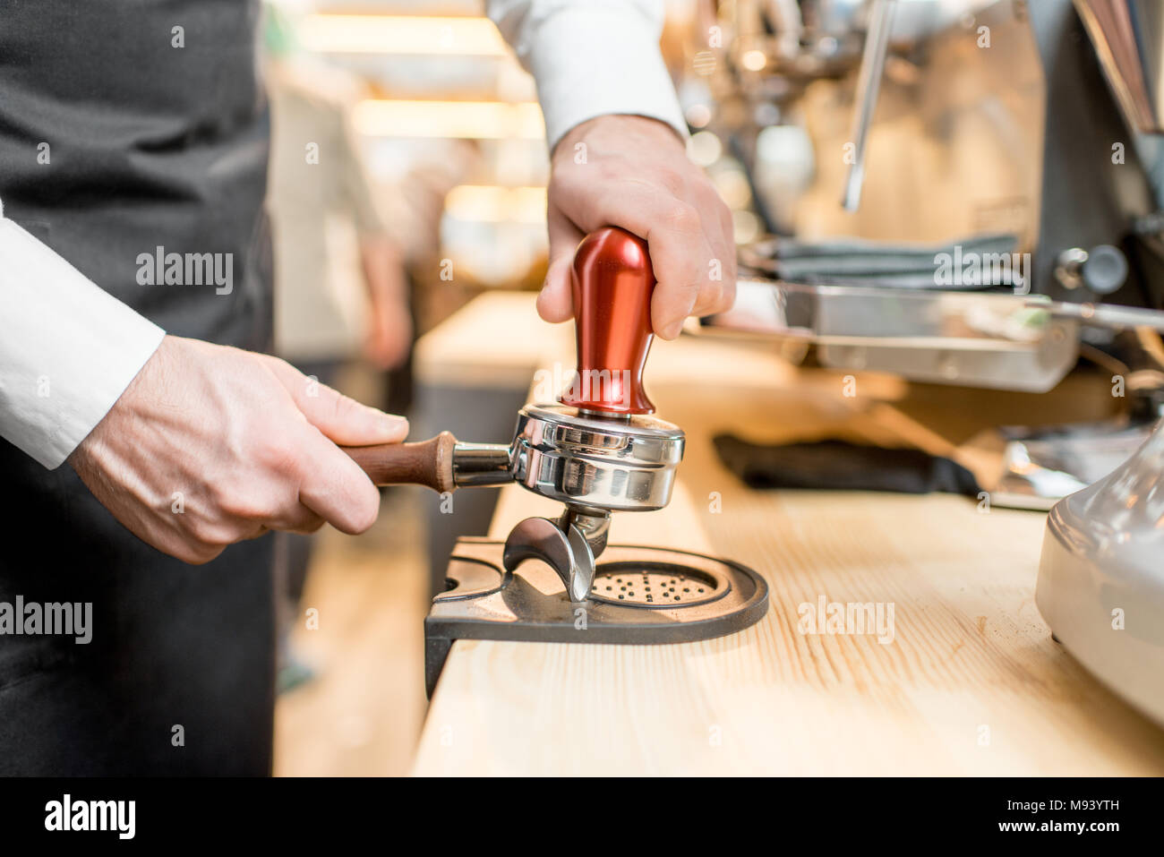 Pressing a coffee into the handle Stock Photo Alamy