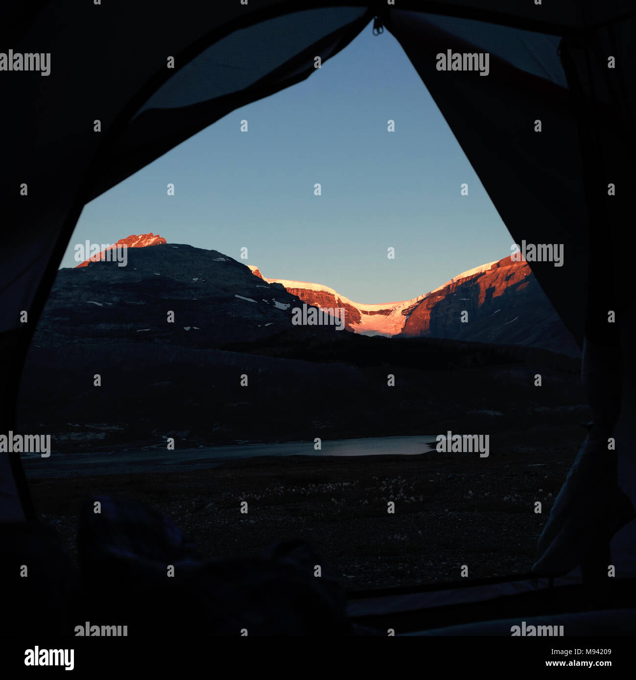 Snow capped mountain on a sunny day Stock Photo - Alamy