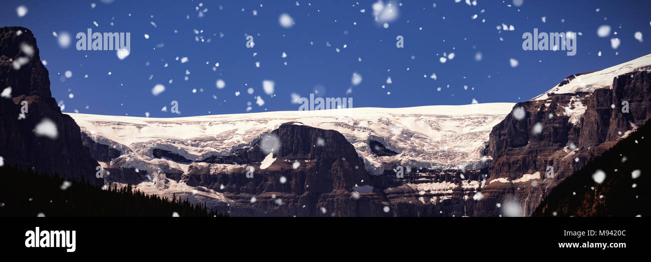 Snow capped mountain on a sunny day Stock Photo - Alamy