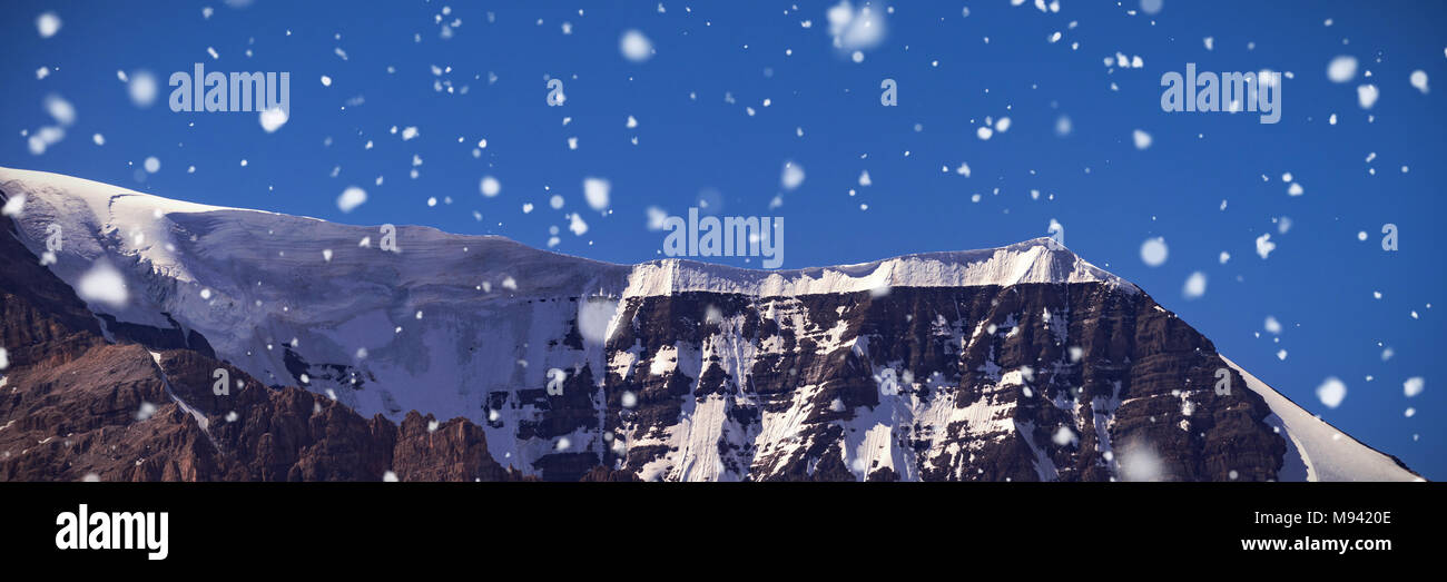 Snow capped mountain on a sunny day Stock Photo - Alamy