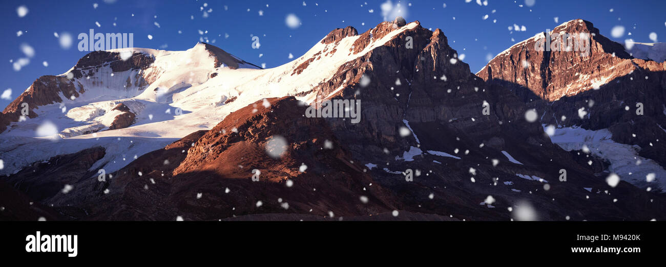 Snow capped mountain on a sunny day Stock Photo - Alamy