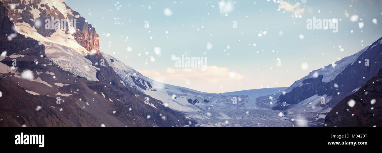 Snow capped mountains on a sunny day Stock Photo - Alamy