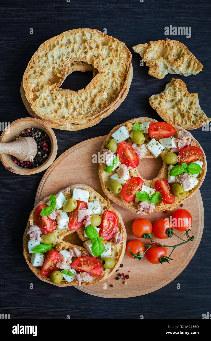 Classical Frisella Tomato Cheese Mozzarella Tuna And Olives Italian Starter Friselle Dried Bread Called Freselle On Wooden Board With Tomatoes Che Stock Photo Alamy