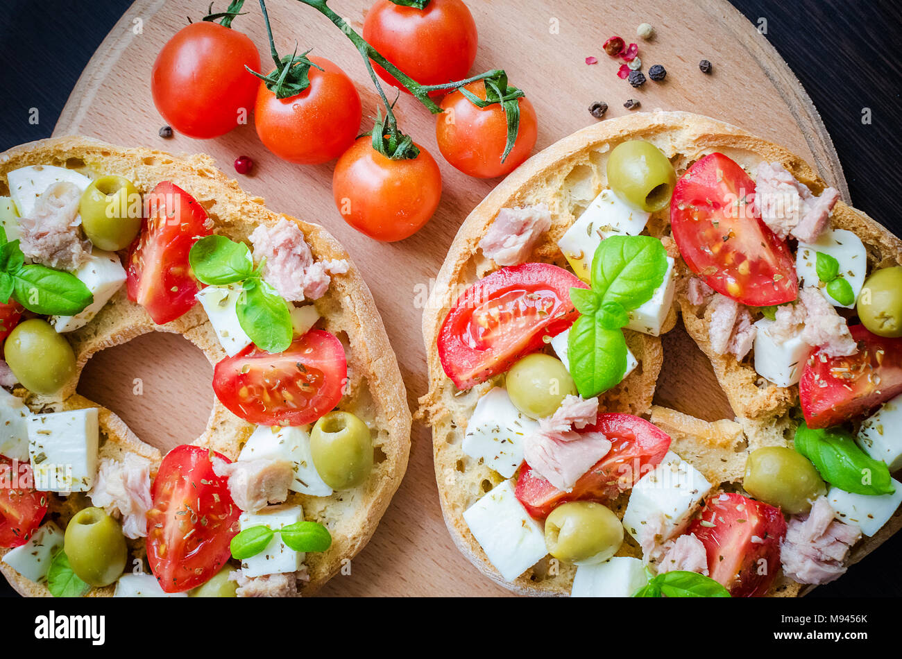 Classical Frisella Tomato Cheese Mozzarella Tuna And Olives Italian Starter Friselle Dried Bread Called Freselle On Wooden Board With Tomatoes Che Stock Photo Alamy
